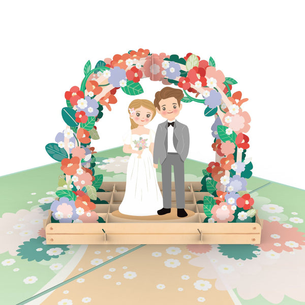 Mariée et marié sous carte pop-up de fleur